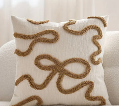 Cream bow boucle detailed cushion with insert 45 x 45 cm
