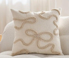 Cream bow boucle detailed cushion with insert 45 x 45 cm