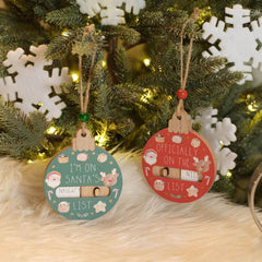 Naughty or nice wooden bauble